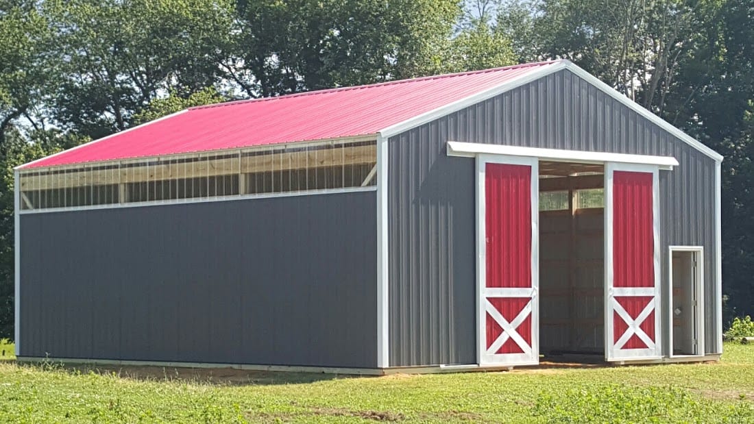 Finished post-frame barndominium home with covered porch