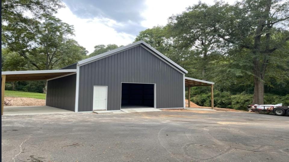 Metal shop-house combination build with attached workshop bays by Ark-La-Tex Shop Builders in Louisiana
